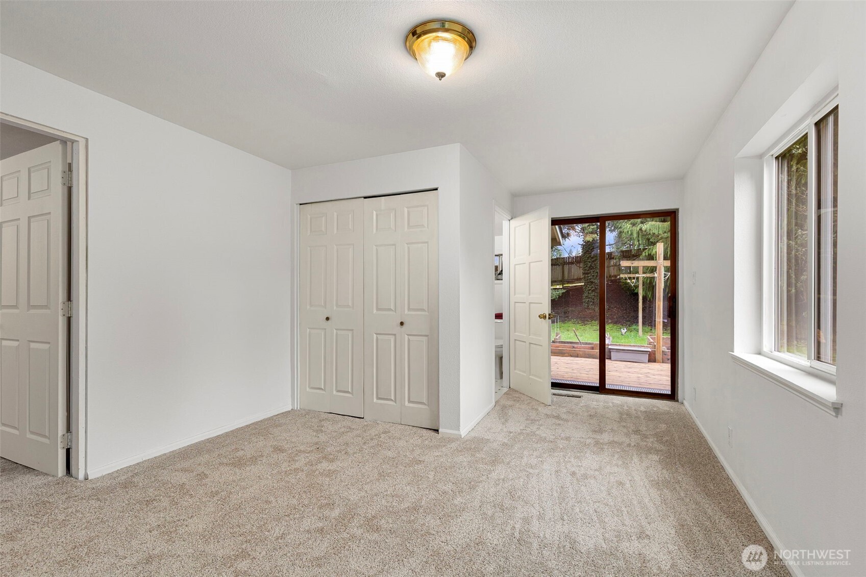 26009 Barrett Road Northeast Kingston, WA 98346 - Photo 16 of 25 a view of an empty room with a window