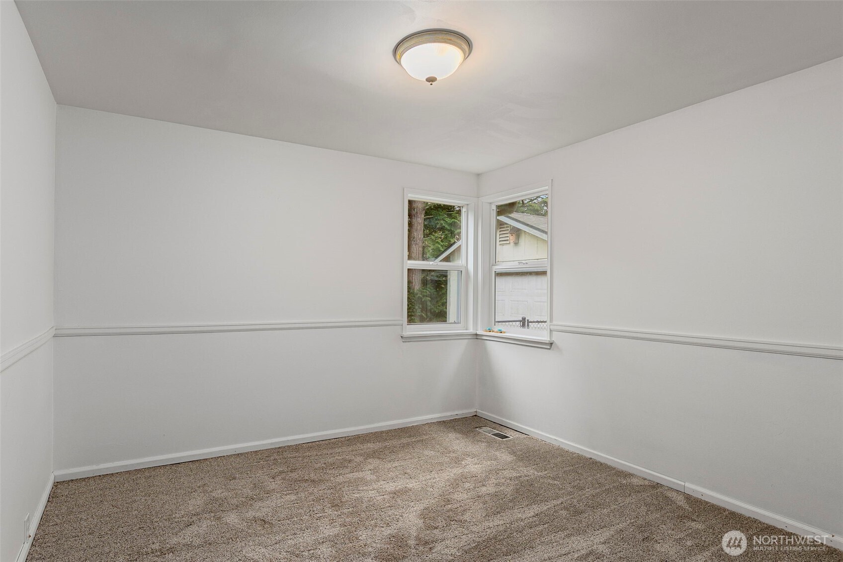 26009 Barrett Road Northeast Kingston, WA 98346 - Photo 18 of 25 an empty room with windows