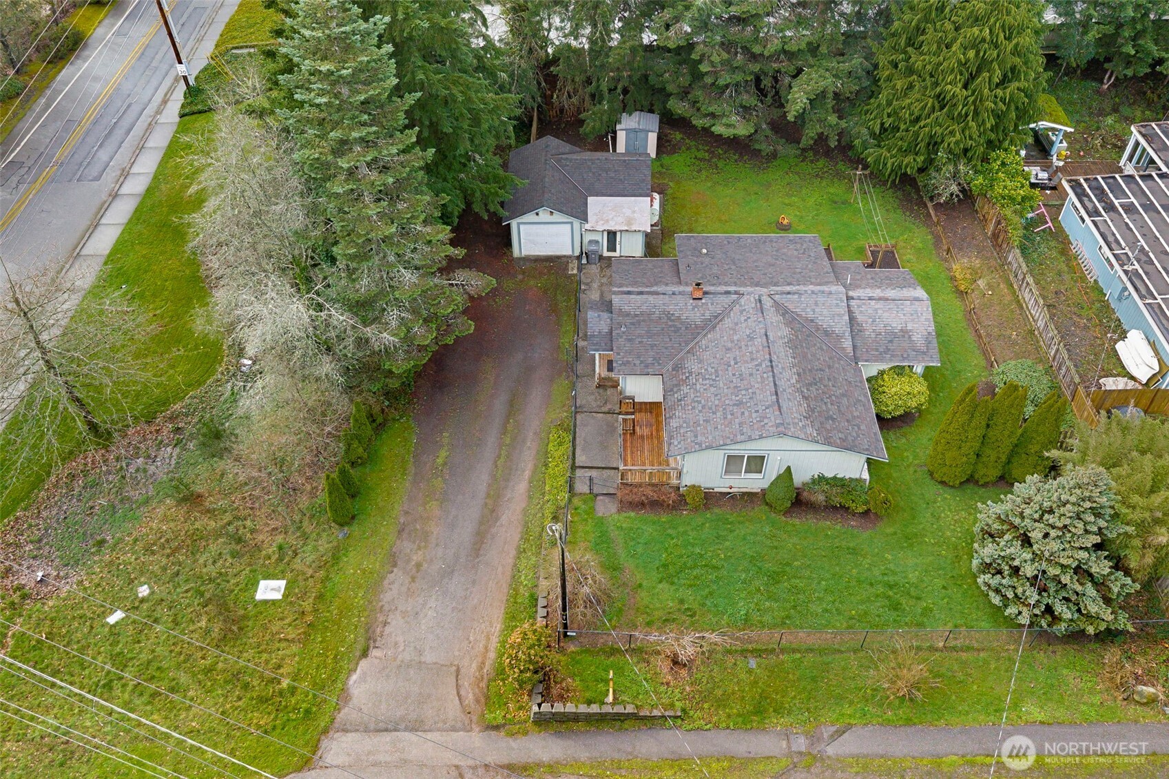 26009 Barrett Road Northeast Kingston, WA 98346 - Photo 24 of 25 an aerial view of residential houses with outdoor space and trees