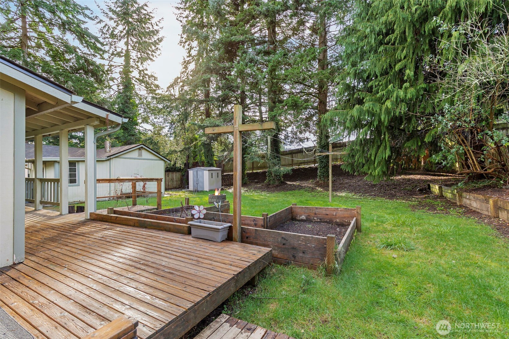 26009 Barrett Road Northeast Kingston, WA 98346 - Photo 4 of 25 a view of a house with backyard and sitting area