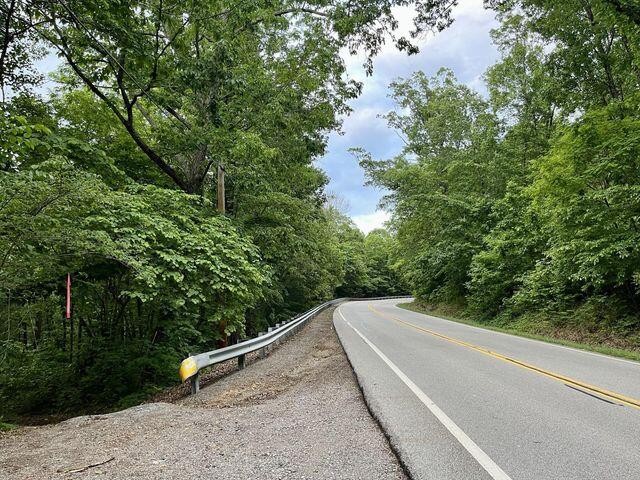 0 Cove Trail Whitwell, TN 37397 - Photo 4 of 9 a view of a forest with a bench and trees