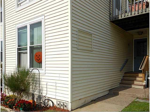 949 Pleasant Valley Road, Unit 59 South Windsor, CT 06074 - Photo 1 of 1 a view of a porch with a door and wooden floor
