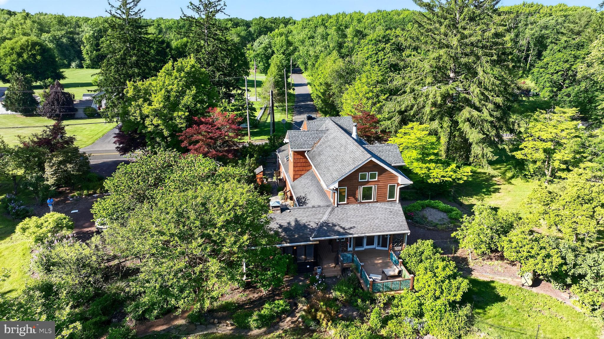 498 Perrineville Road Robbinsville, NJ 08691 - Photo 54 of 59 an aerial view of a house with a yard and large trees