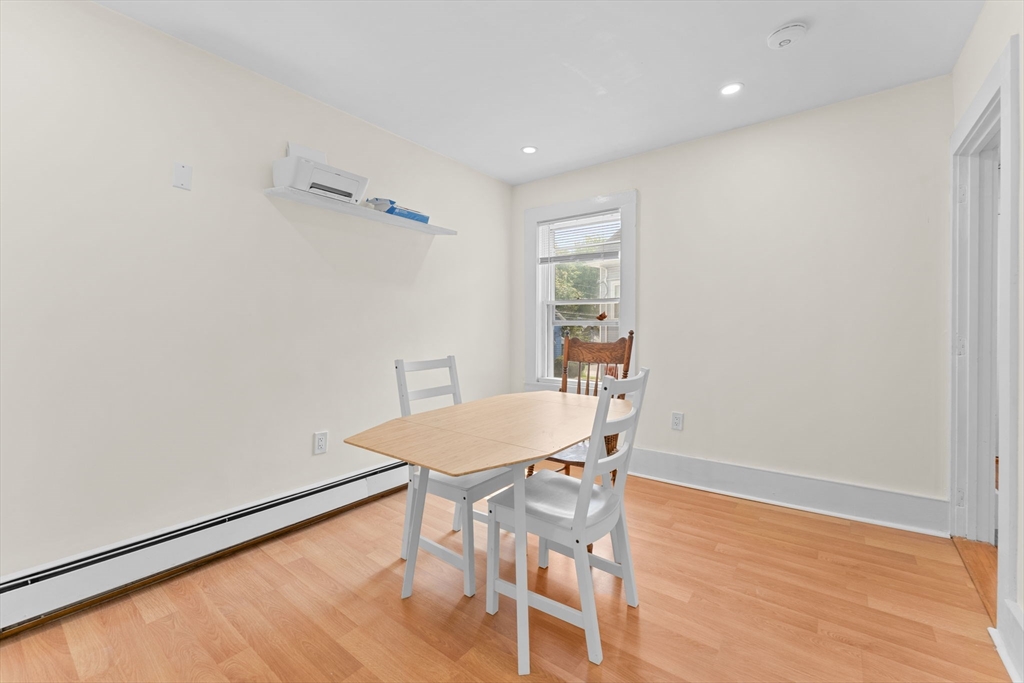 14 Glendale Street, Unit 14 Maynard, MA 01754 - Photo 13 of 29 a workspace with furniture and wooden floor