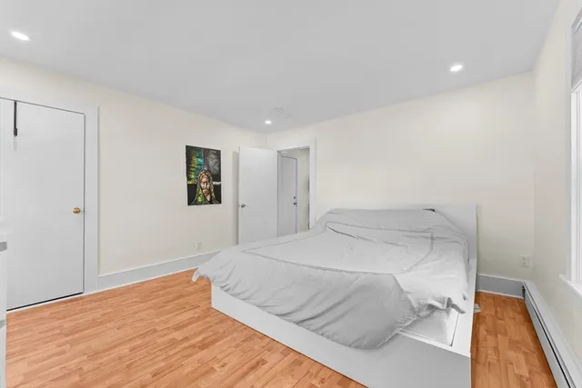 a bedroom with a bed and a view of bathroom