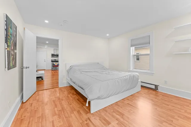 a bedroom with a bed and a view of bathroom