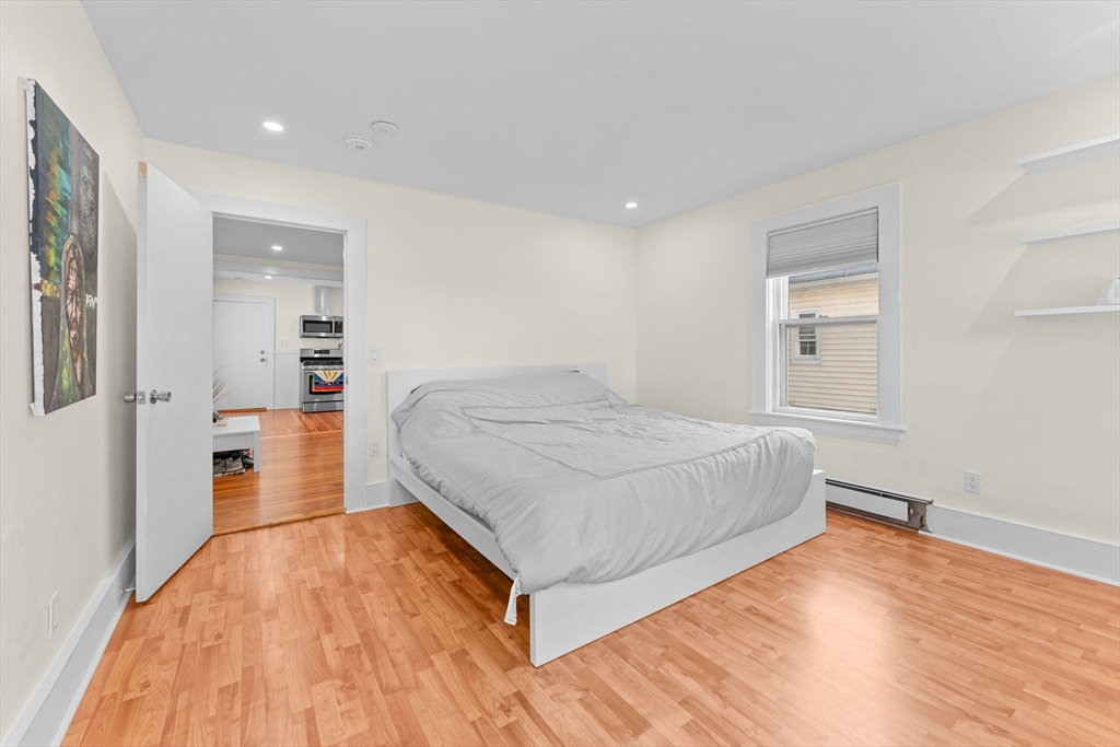 14 Glendale Street, Unit 14 Maynard, MA 01754 - Photo 15 of 29 a bedroom with a bed and a view of bathroom