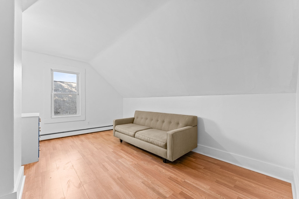 14 Glendale Street, Unit 14 Maynard, MA 01754 - Photo 21 of 29 a living room with furniture and a hard wood floor