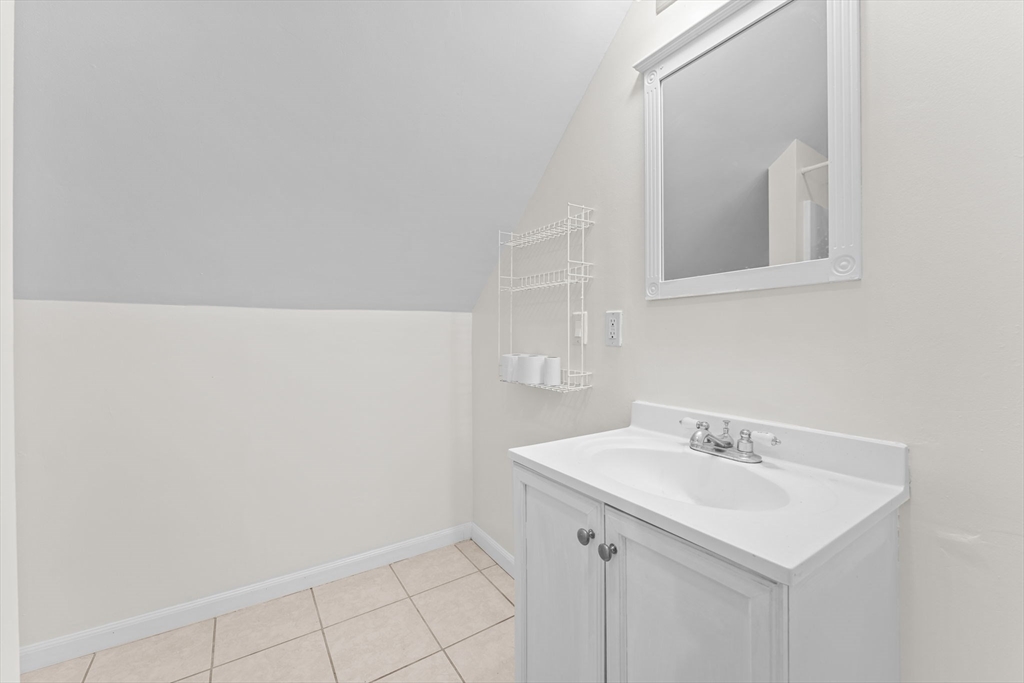 14 Glendale Street, Unit 14 Maynard, MA 01754 - Photo 23 of 29 a bathroom with a sink and a mirror