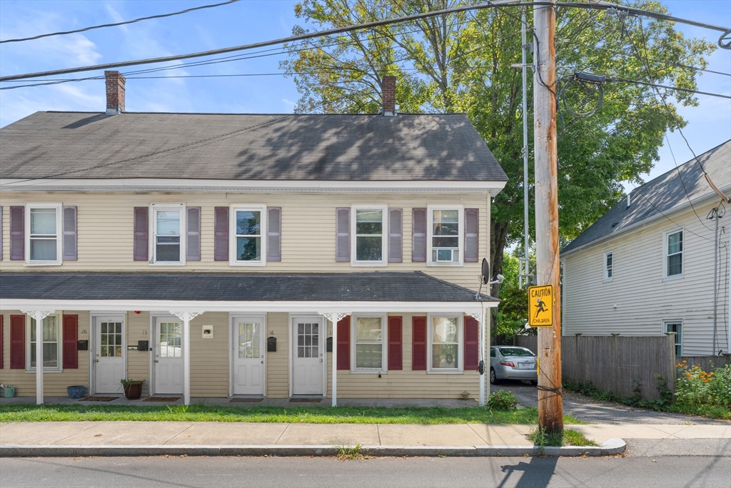 14 Glendale Street, Unit 14 Maynard, MA 01754 - Photo 27 of 29 a front view of a house with a garden