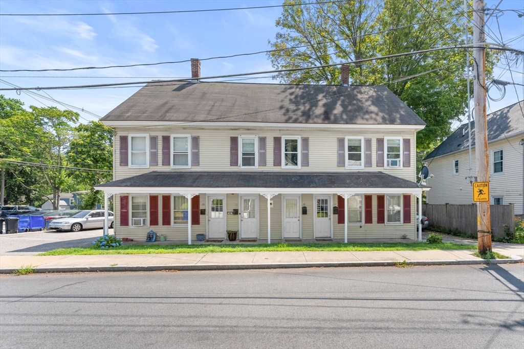 14 Glendale Street, Unit 14 Maynard, MA 01754 - Photo 29 of 29 a front view of building with yard and traffic signal