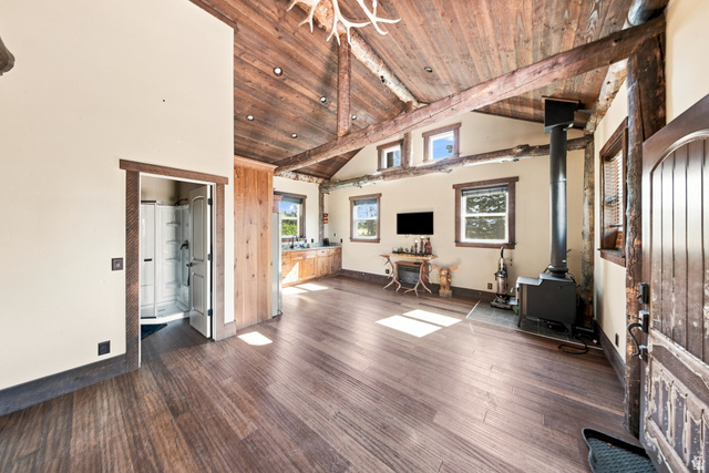 1063 West Kolob Ranch Drive Springdale, UT 84767 - Photo 41 of 61 Vaulted wood-plank ceilings with exposed beams, wood-finish flooring, and multiple windows