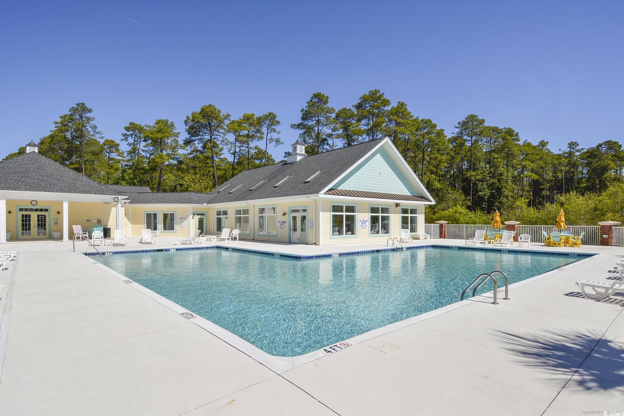 1029 Ray Costin Way, Unit VILLA 906 Murrells Inlet, SC 29576 - Photo 35 of 40 Community pool featuring french doors and a patio area