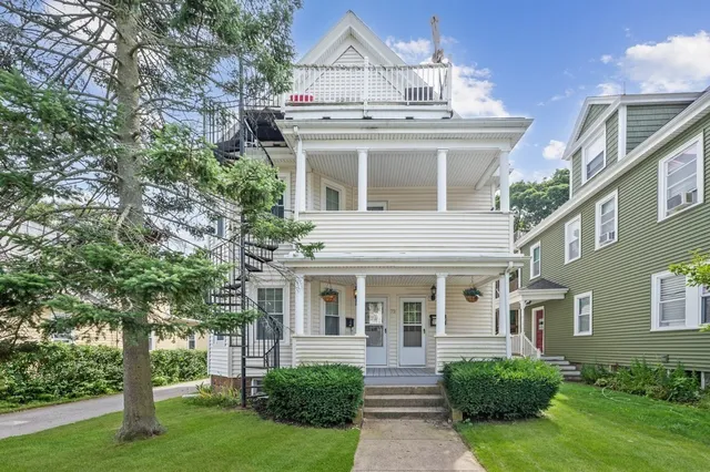 front view of a house with a yard