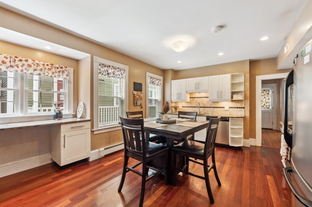 73 Cranch Street, Unit 73 Quincy, MA 02169 - Photo 12 of 22 a view of a dining room with furniture window and wooden floor