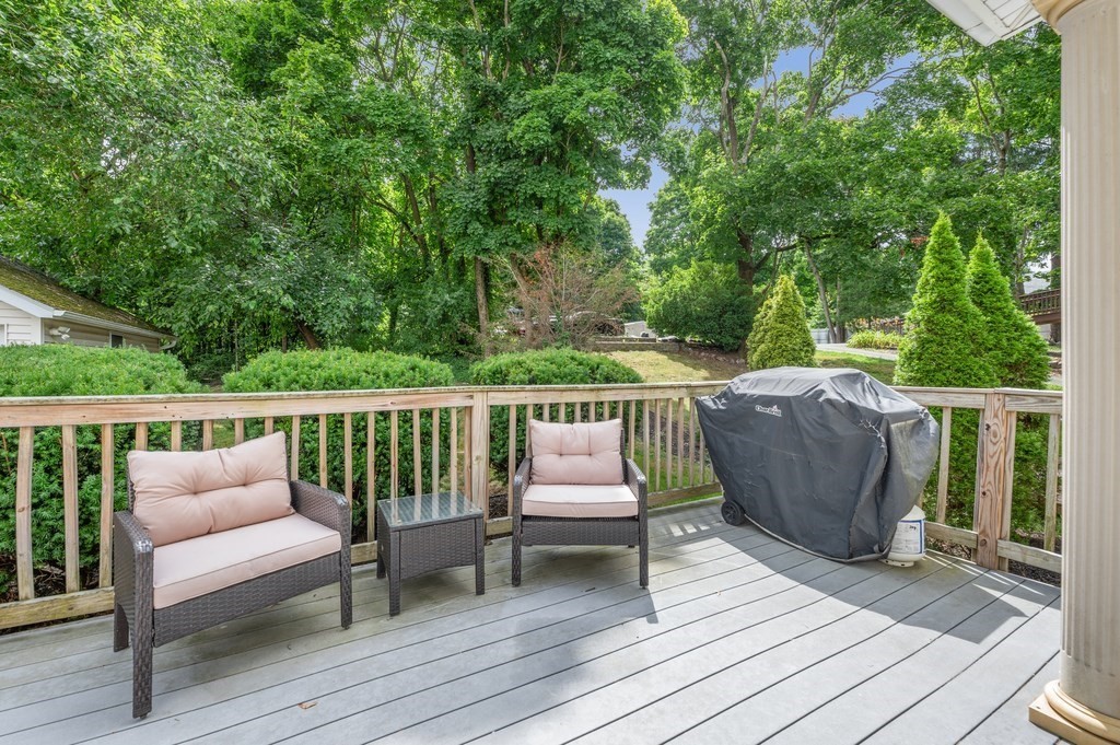 73 Cranch Street, Unit 73 Quincy, MA 02169 - Photo 17 of 22 a balcony with wooden floor table and chairs