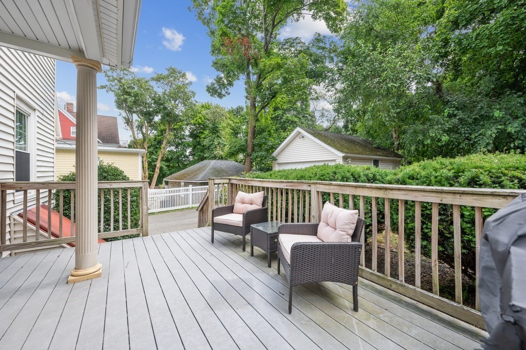 73 Cranch Street, Unit 73 Quincy, MA 02169 - Photo 18 of 22 a view of a wooden chairs on deck