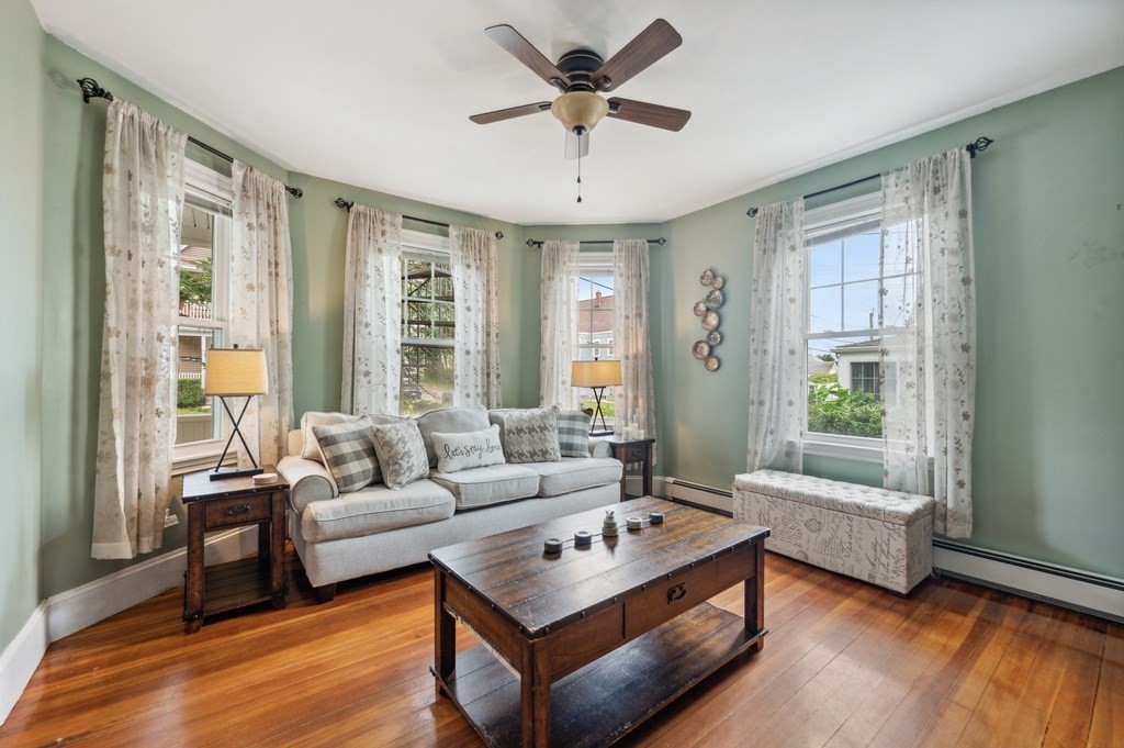 73 Cranch Street, Unit 73 Quincy, MA 02169 - Photo 3 of 22 a living room with furniture and a large window