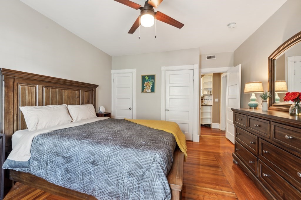 73 Cranch Street, Unit 73 Quincy, MA 02169 - Photo 8 of 22 a bedroom with a bed and wooden floor