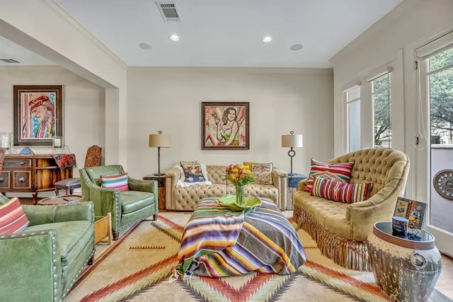 a living room with furniture and a rug