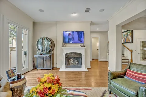 a living room with furniture fireplace and flat screen tv