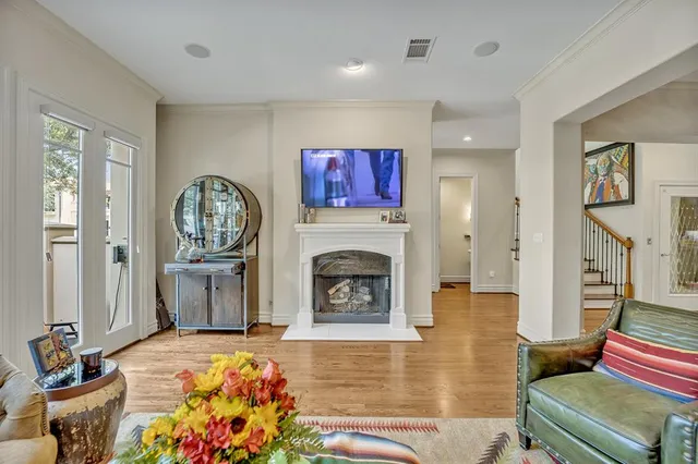 a living room with furniture fireplace and flat screen tv