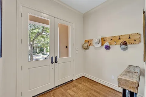 a view of a livingroom with wooden floor and a window