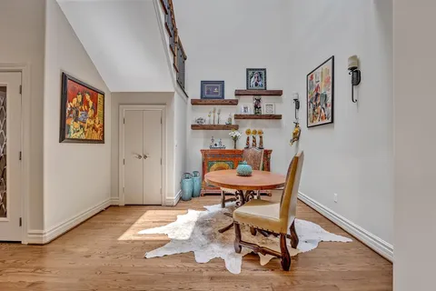 a workspace room with furniture and wooden floor