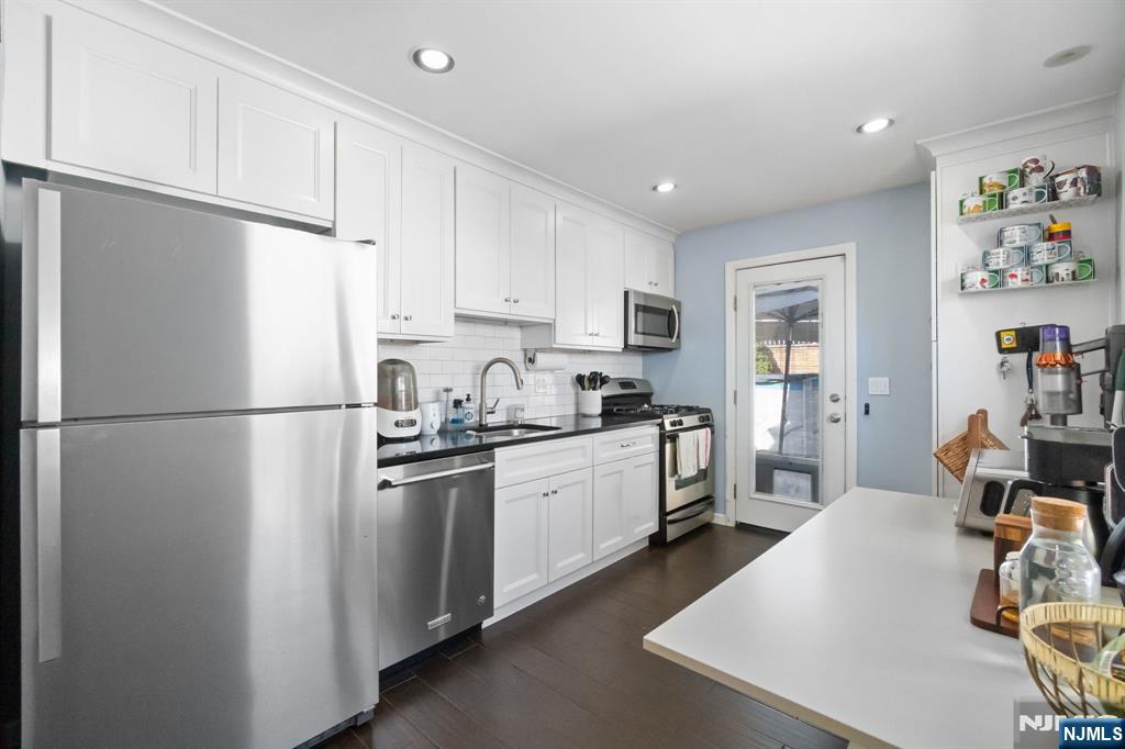 340 Marsan Drive Carlstadt, NJ 07072 - Photo 20 of 50 a kitchen with cabinets and stainless steel appliances