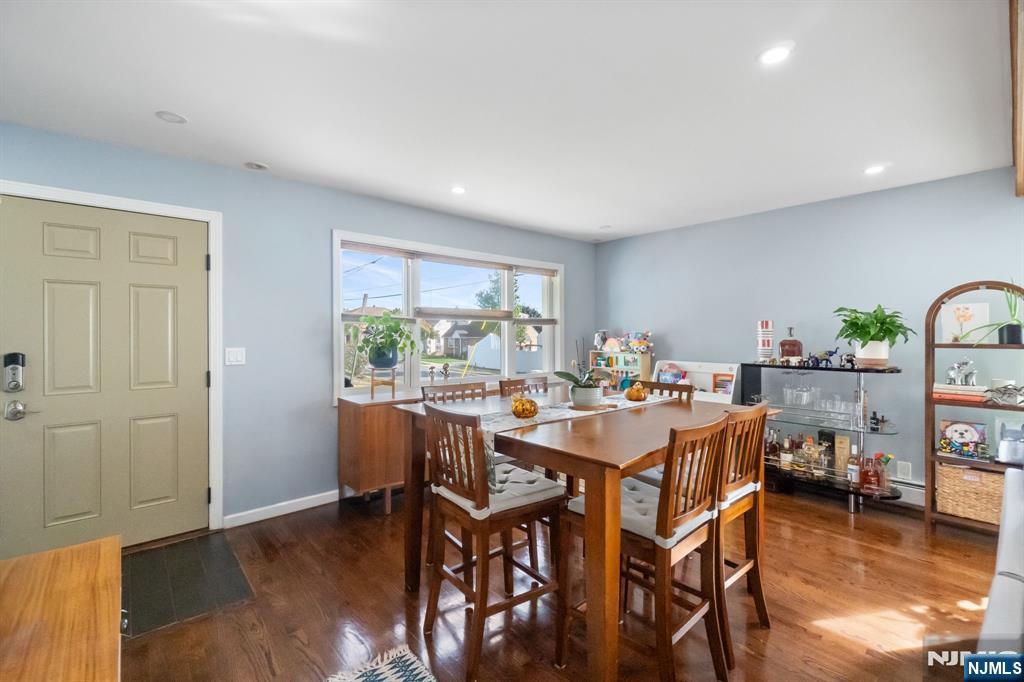 340 Marsan Drive Carlstadt, NJ 07072 - Photo 29 of 50 a view of a dining room with furniture and wooden floor