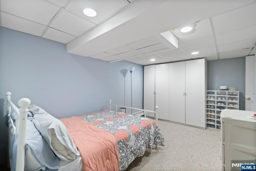 340 Marsan Drive Carlstadt, NJ 07072 - Photo 36 of 50 a bedroom with a bed and a walk in closet