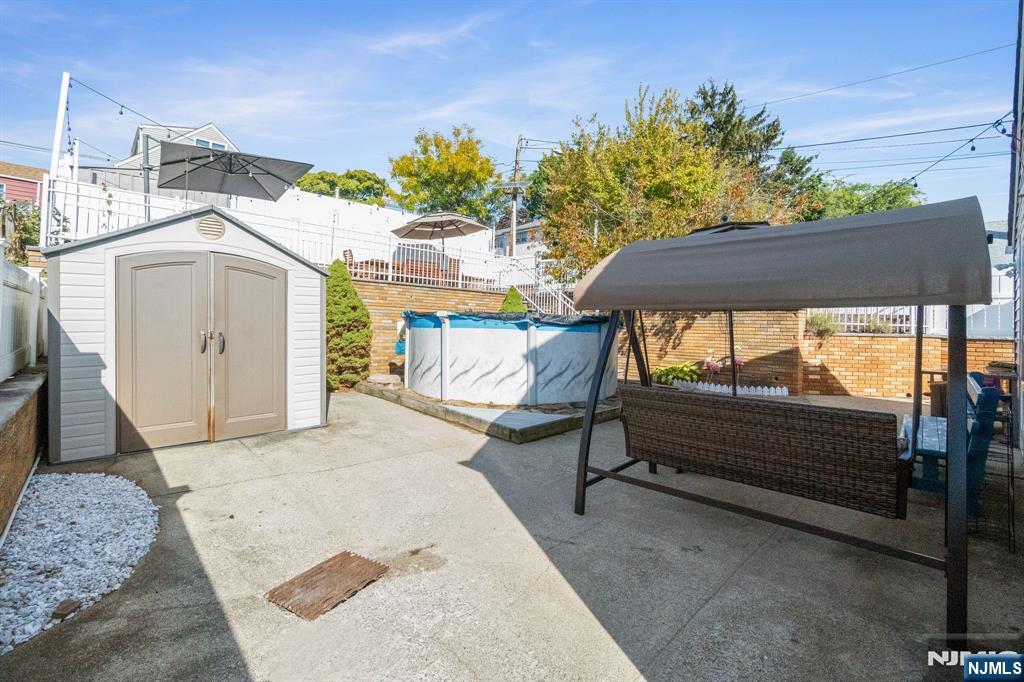 340 Marsan Drive Carlstadt, NJ 07072 - Photo 39 of 50 a bedroom with a bed and a table