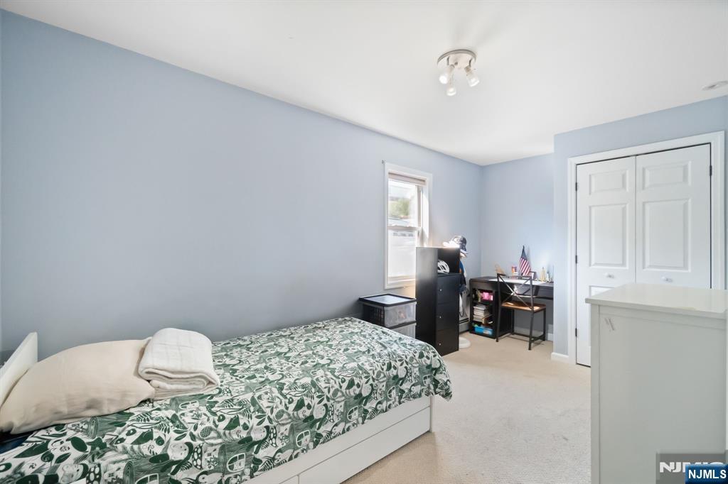 340 Marsan Drive Carlstadt, NJ 07072 - Photo 6 of 50 a bedroom with a bed and a window
