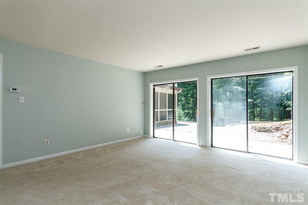 11604 Black Horse Run Raleigh, NC 27613 - Photo 17 of 29 a view of an empty room with glass door