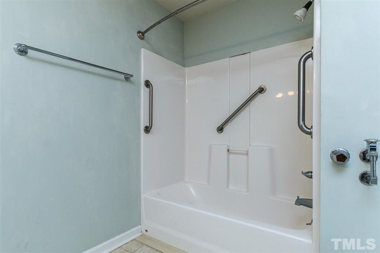 11604 Black Horse Run Raleigh, NC 27613 - Photo 19 of 29 a bathroom with a bathtub
