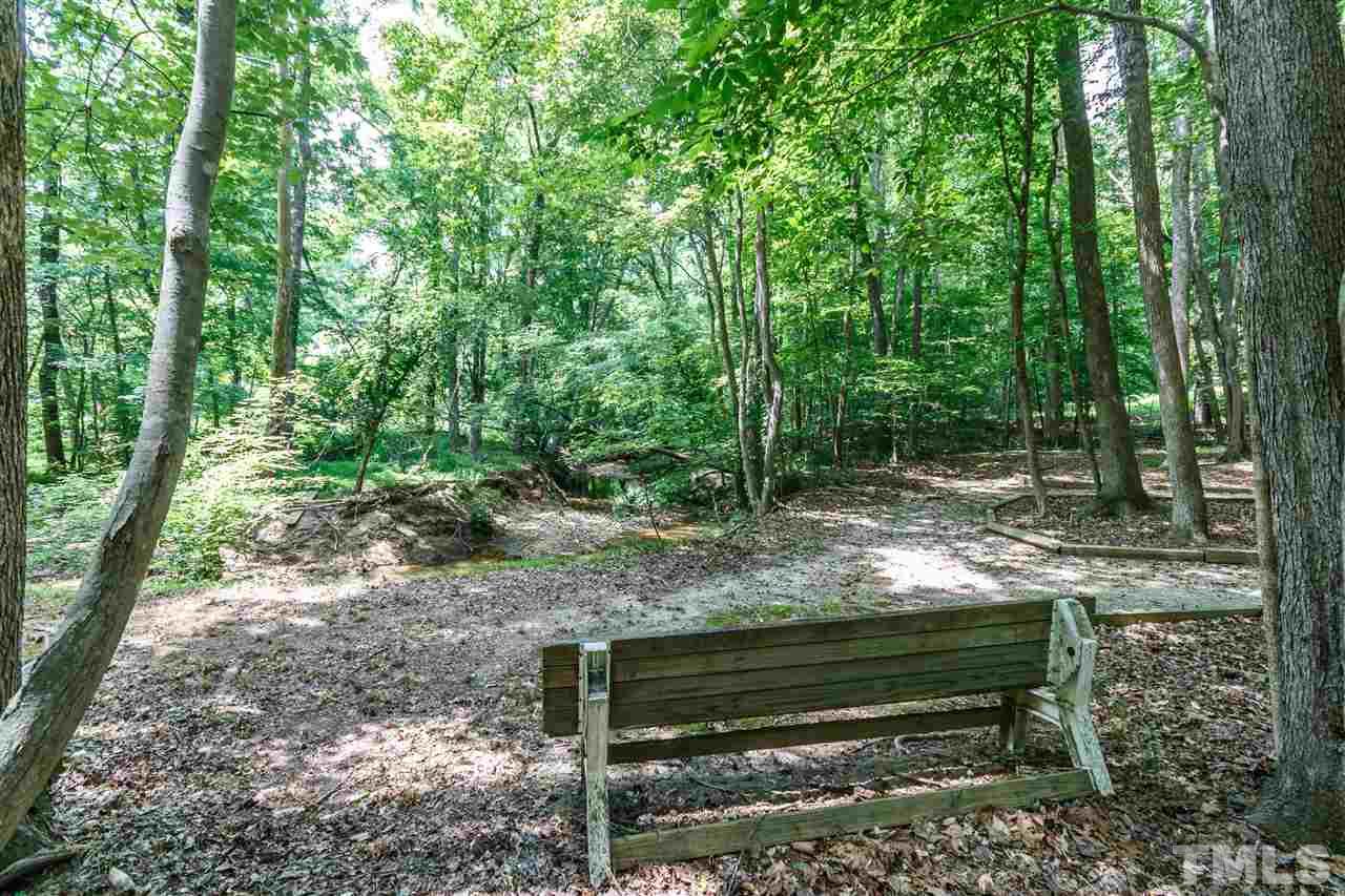 11604 Black Horse Run Raleigh, NC 27613 - Photo 24 of 29 a view of a bench in a garden