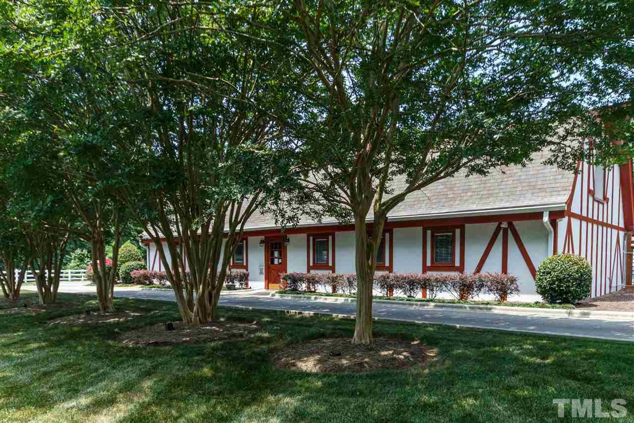 11604 Black Horse Run Raleigh, NC 27613 - Photo 26 of 29 a front view of a house with garden