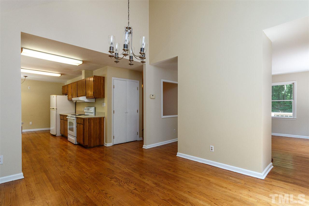 11604 Black Horse Run Raleigh, NC 27613 - Photo 5 of 29 a view of a kitchen with a sink and dishwasher a refrigerator with wooden floor