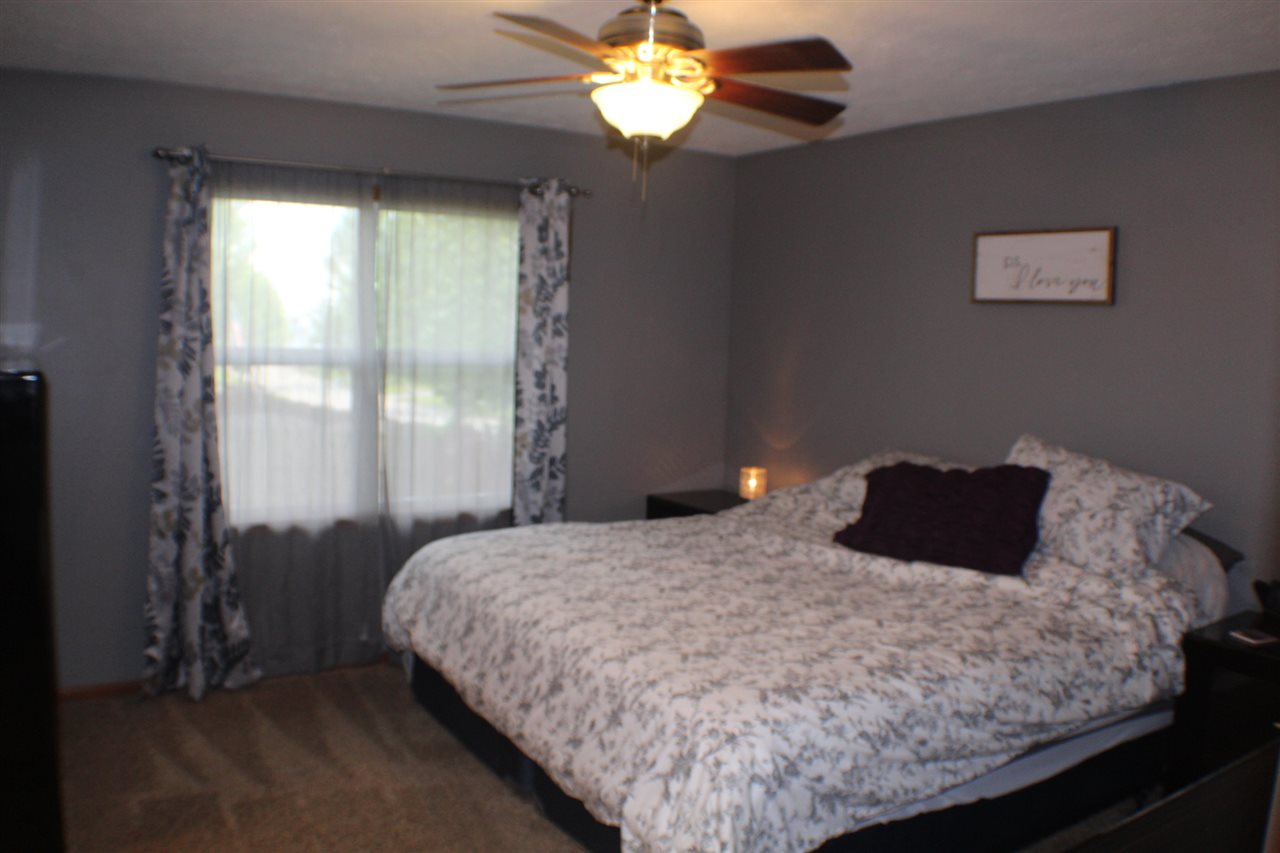 5375 Rockingham Drive Loves Park, IL 61111 - Photo 8 of 25 a bedroom with a bed mirror and window