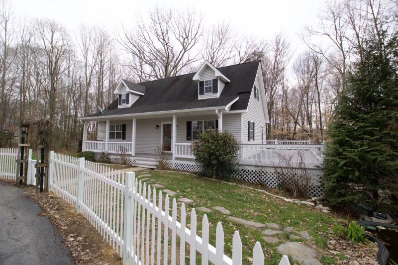 150 Redbud Road Red Boiling Springs, TN 37150 - Photo 1 of 15 a view of a house with a small yard and wooden fence