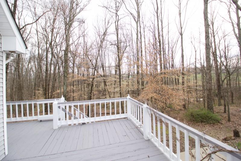 150 Redbud Road Red Boiling Springs, TN 37150 - Photo 14 of 15 a view of a wooden fence with large trees