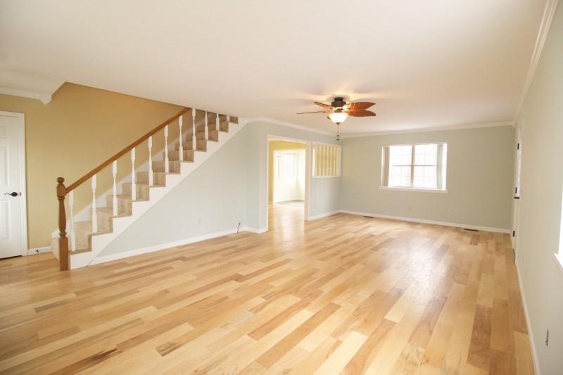 150 Redbud Road Red Boiling Springs, TN 37150 - Photo 3 of 15 a view of an empty room with wooden floor and a window