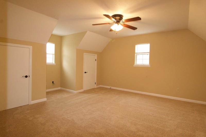 150 Redbud Road Red Boiling Springs, TN 37150 - Photo 10 of 15 an empty room with closet and a chandelier fan