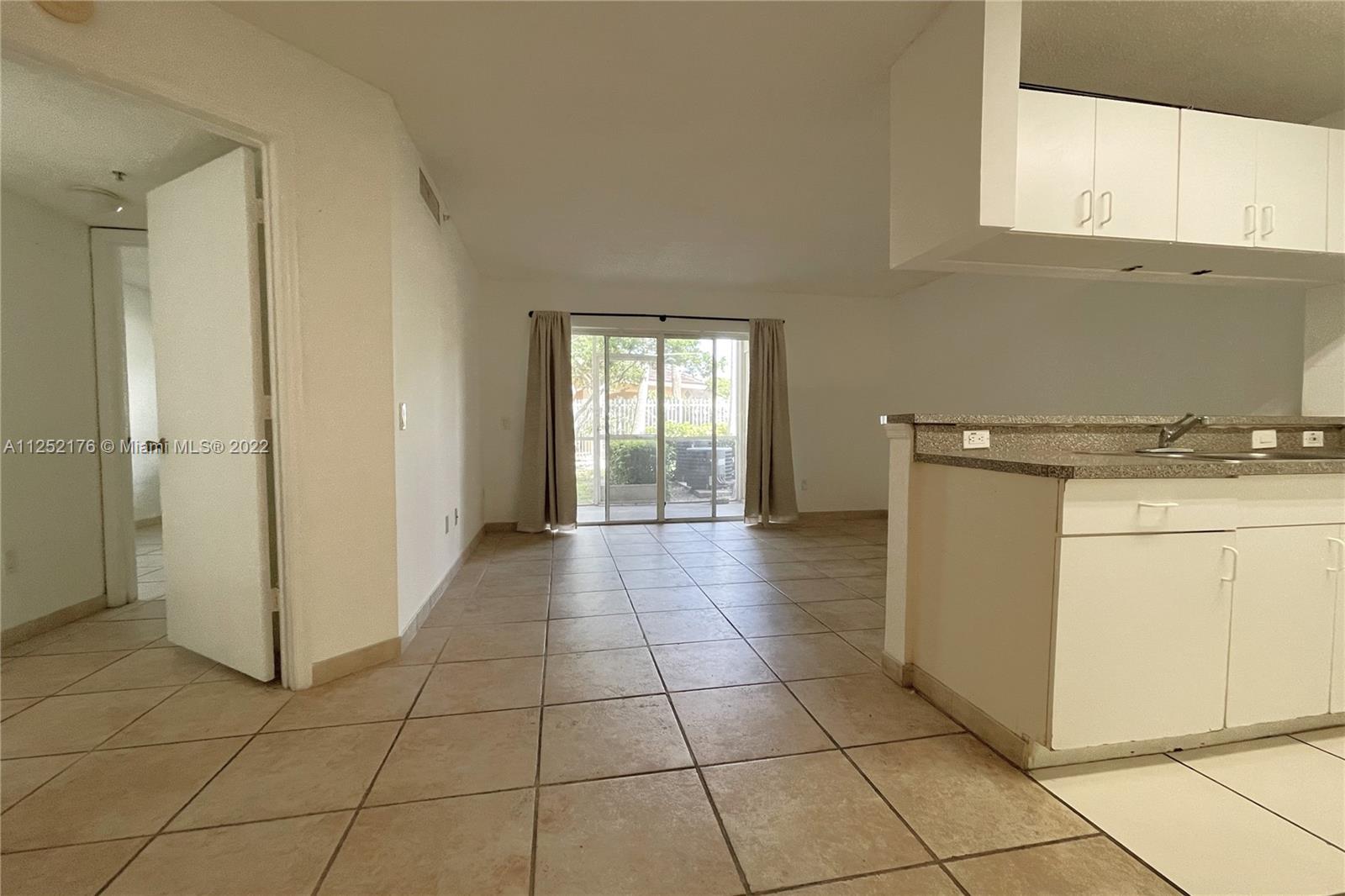 420 South Park Road, Unit 2105 Hollywood, FL 33021 - Photo 6 of 11 a view of a kitchen with storage and utility