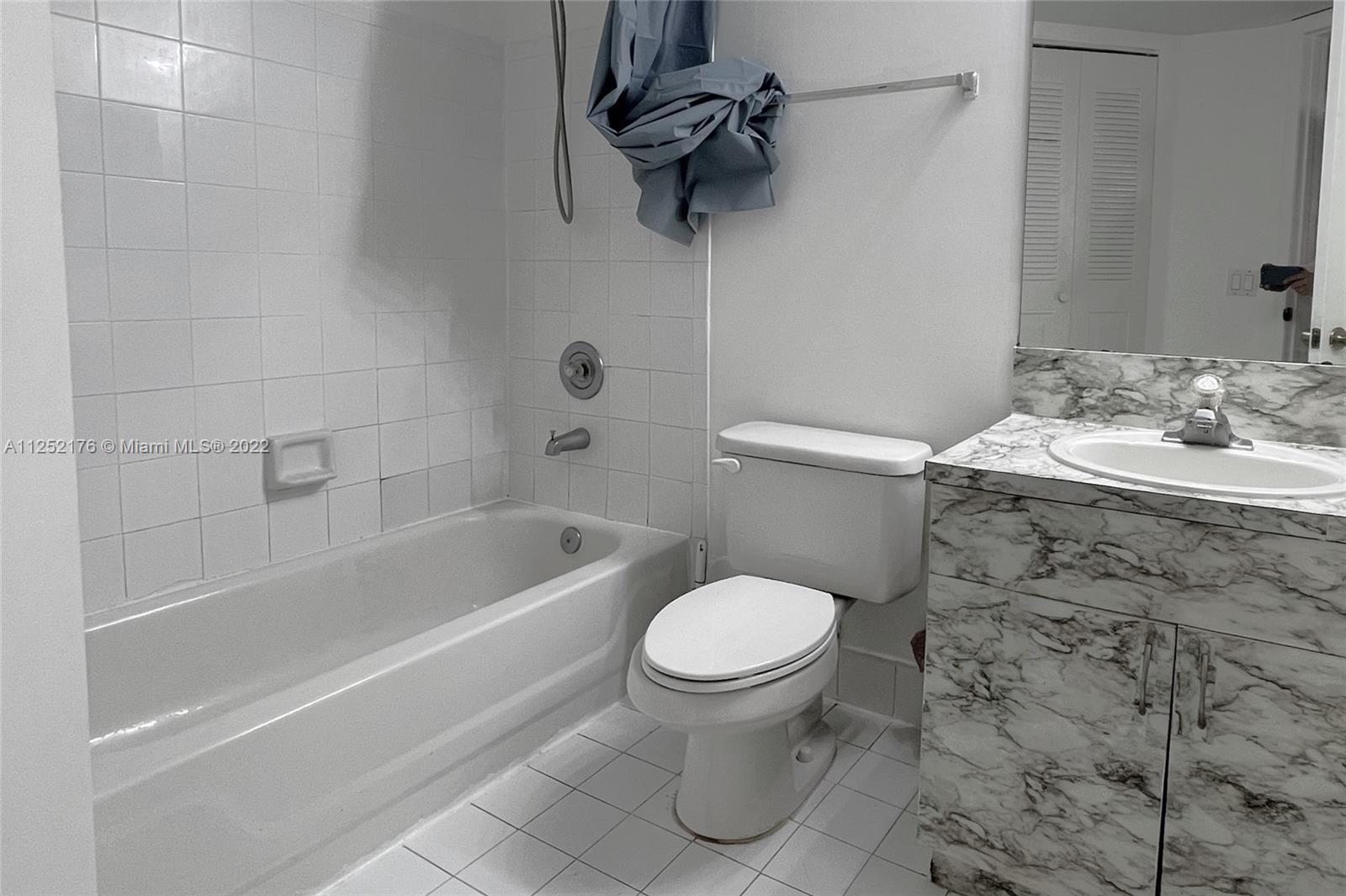 420 South Park Road, Unit 2105 Hollywood, FL 33021 - Photo 8 of 11 a bathroom with a sink toilet and shower
