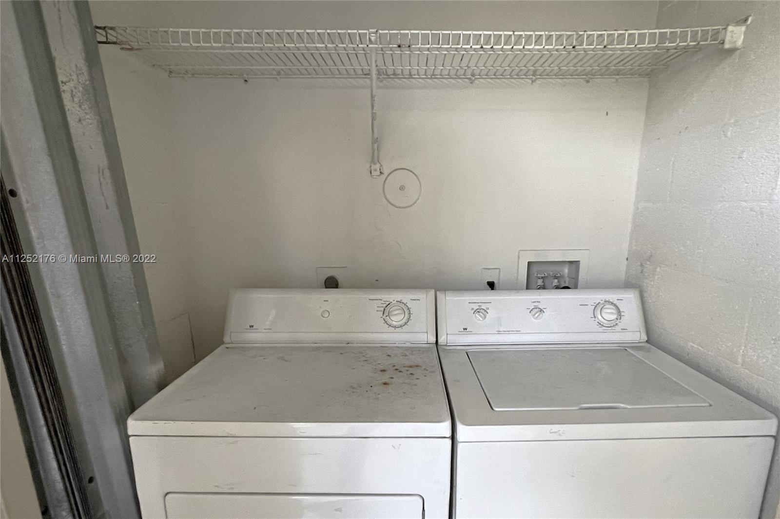 420 South Park Road, Unit 2105 Hollywood, FL 33021 - Photo 10 of 11 a utility room with dryer and washer