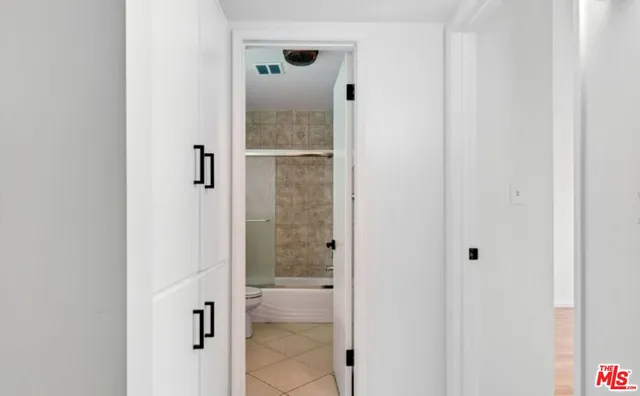 a bathroom with a glass shower door