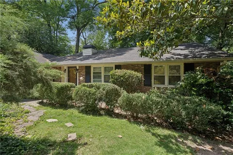 a view of a house with a garden