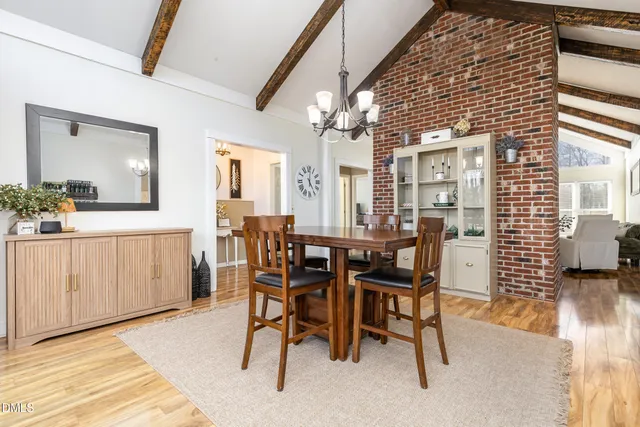 a kitchen with stainless steel appliances granite countertop a sink a stove and cabinets