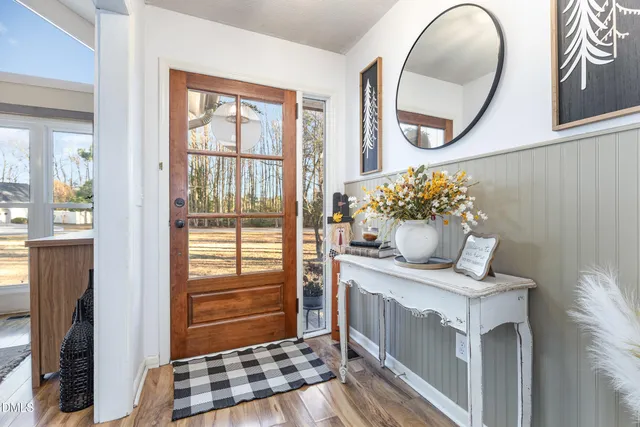 a view of living room with furniture and wooden floor